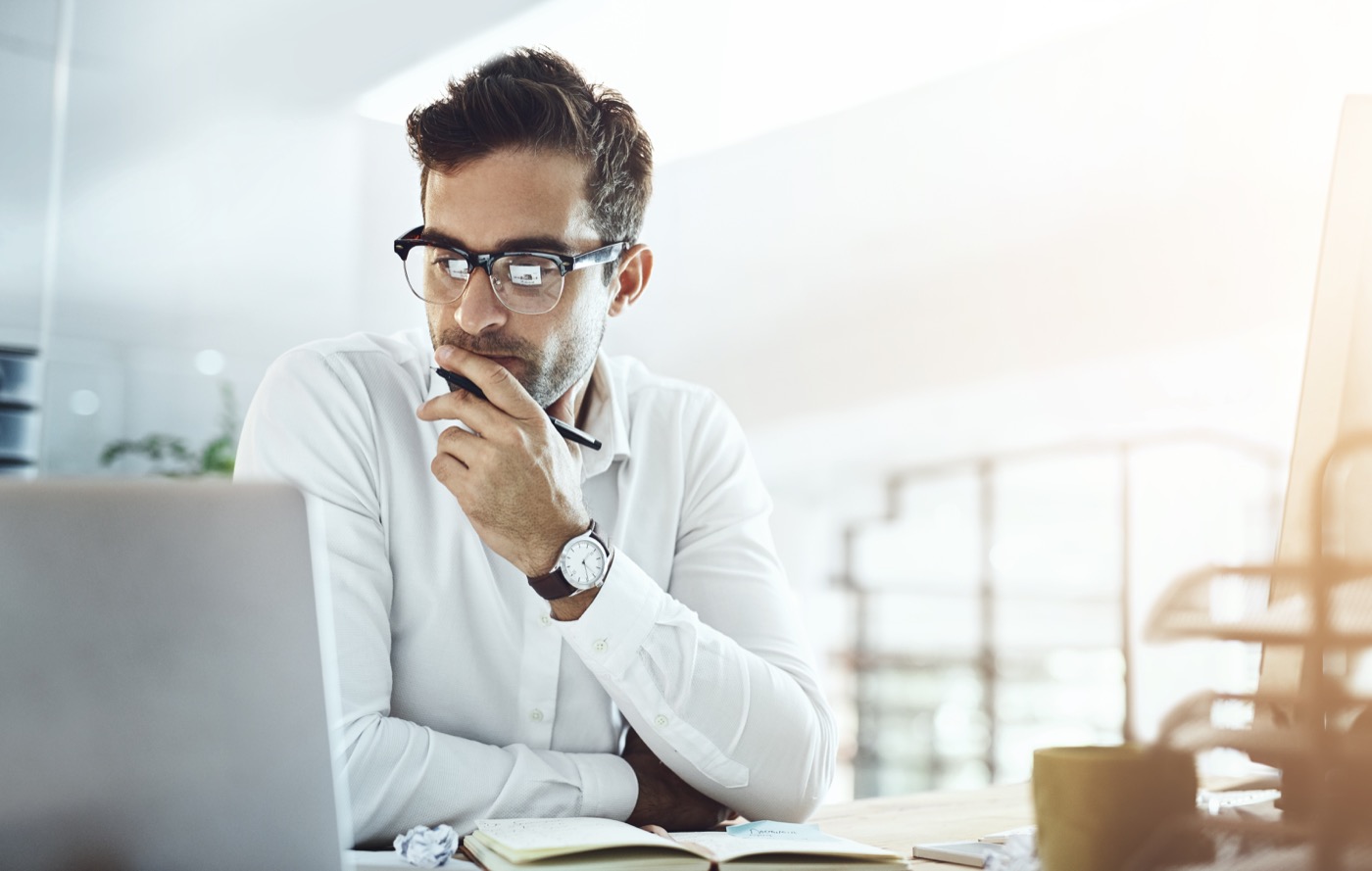 Business owner reviewing finance on a laptop