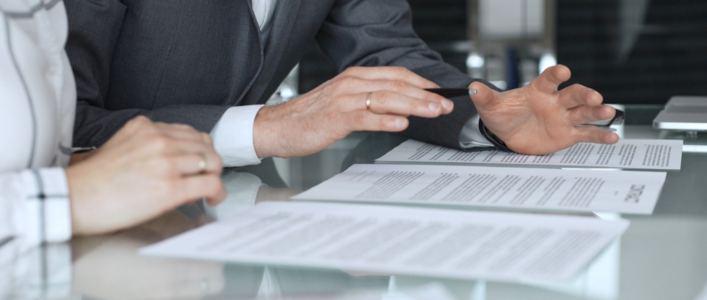 Experienced advisor reviewing finance papers